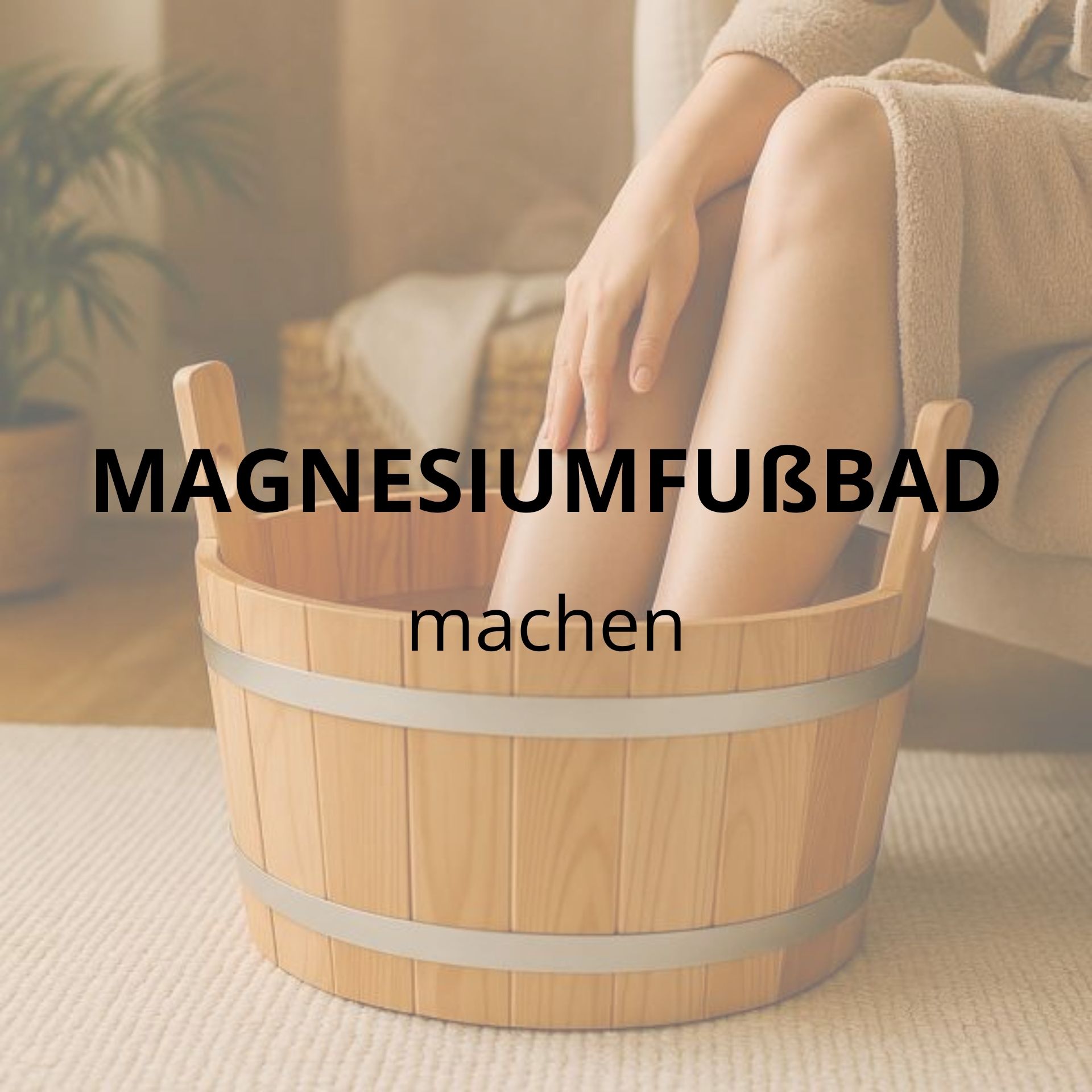 Person sitzt im Bademantel und macht ein wohltuendes Fußbad in einer Holzschale – Thema Magnesiumfußbad